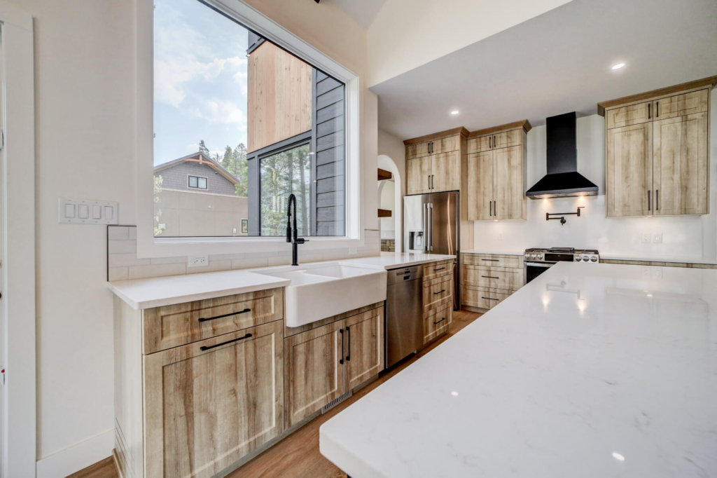 Semi-custom cabinetry with European-style construction and a rustic wood style